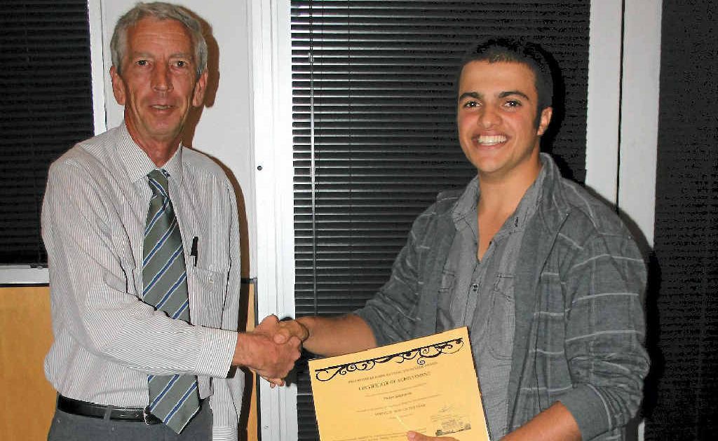 GREAT PERSON: Warwick Apex member Peter Hardwick presents Peter Gasparin with his Young Person of the Year award. GREAT PERSON: Warwick Apex member Peter Hardwick presents Peter Gasparin with his Young Person of the Year award.